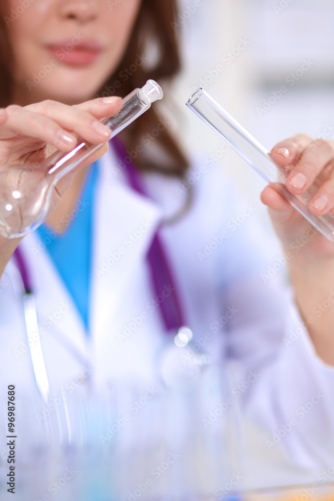 Woman researcher is surrounded by medical vials and flasks, isolated on white background