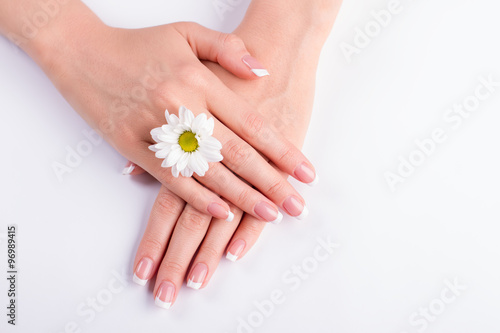 Manicure with a white chrysanthemum.