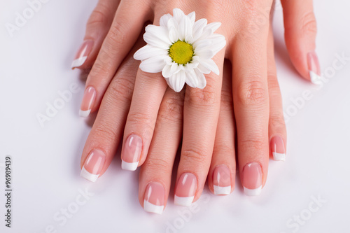 Beauty delicate hands with manicure.
