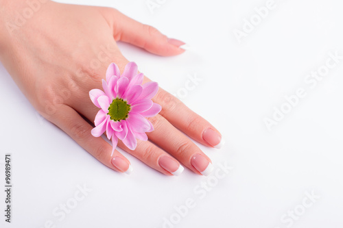 French manicure and gentle pink flower.
