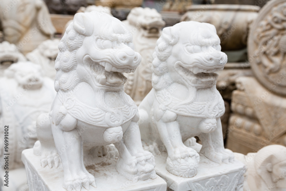 Chinese mythological sculpture in stone at a flea market Chinese mythological sculpture in stone at a flea market