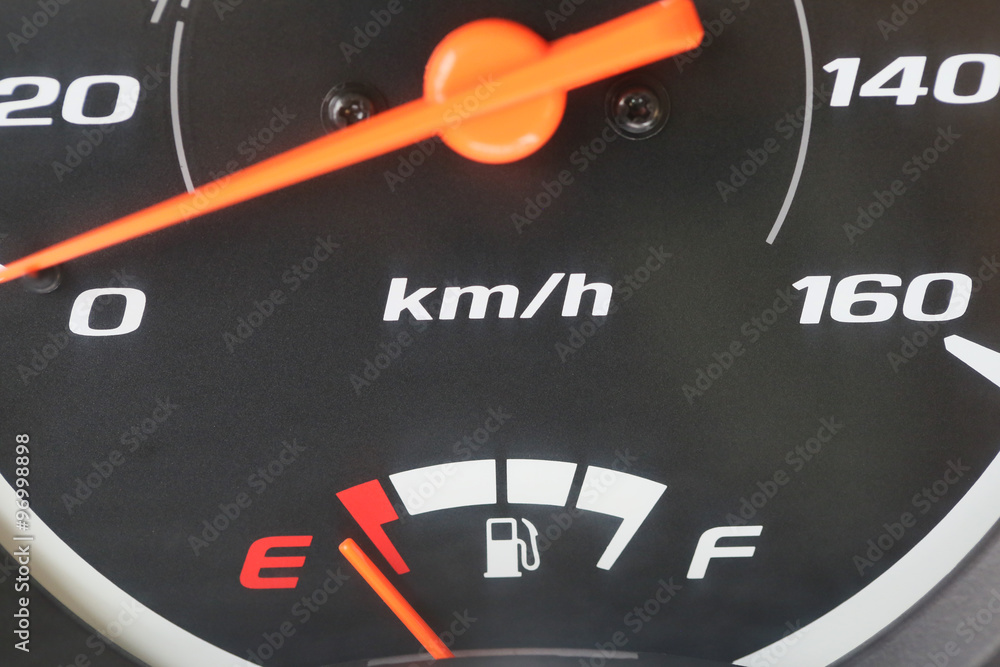 Fuel gauge with warning indicating low fuel tank. Fuel gauge with warning indicating low fuel tank.