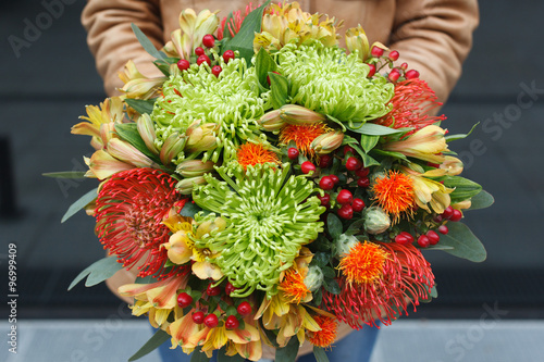 Autumn bouquet of chrysanthemum, carthamus, nutans, hypericum and alstroemeria