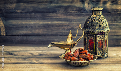 Photographie Ramadan lamp and dates on wooden background. Oriental lantern