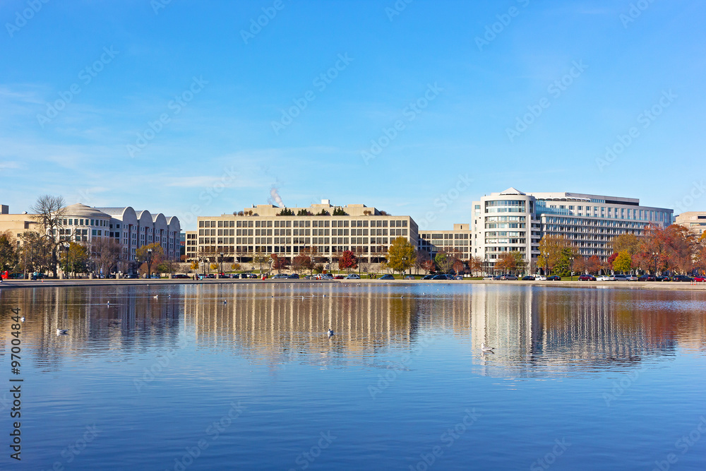 Fototapeta premium The Capitol Reflecting pool in Washington DC at sunset in autumn. City panorama of US capital near the pool.