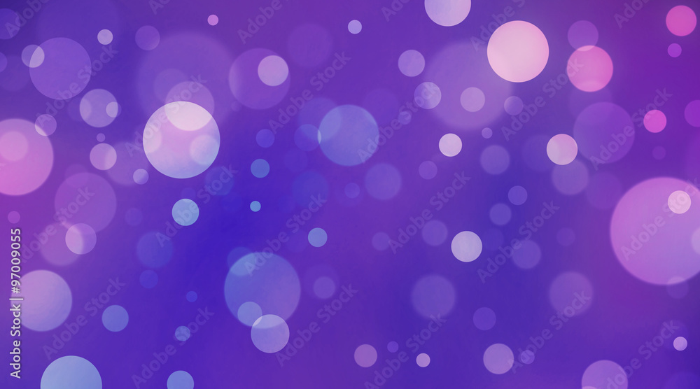 The Abstract bokeh lighting on purple background