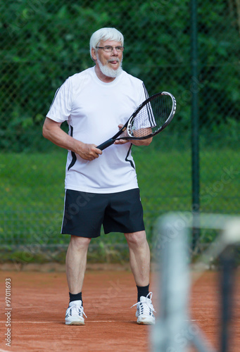Senior man playing tennis © michaklootwijk