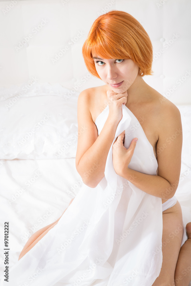 Red-haired woman in lingerie