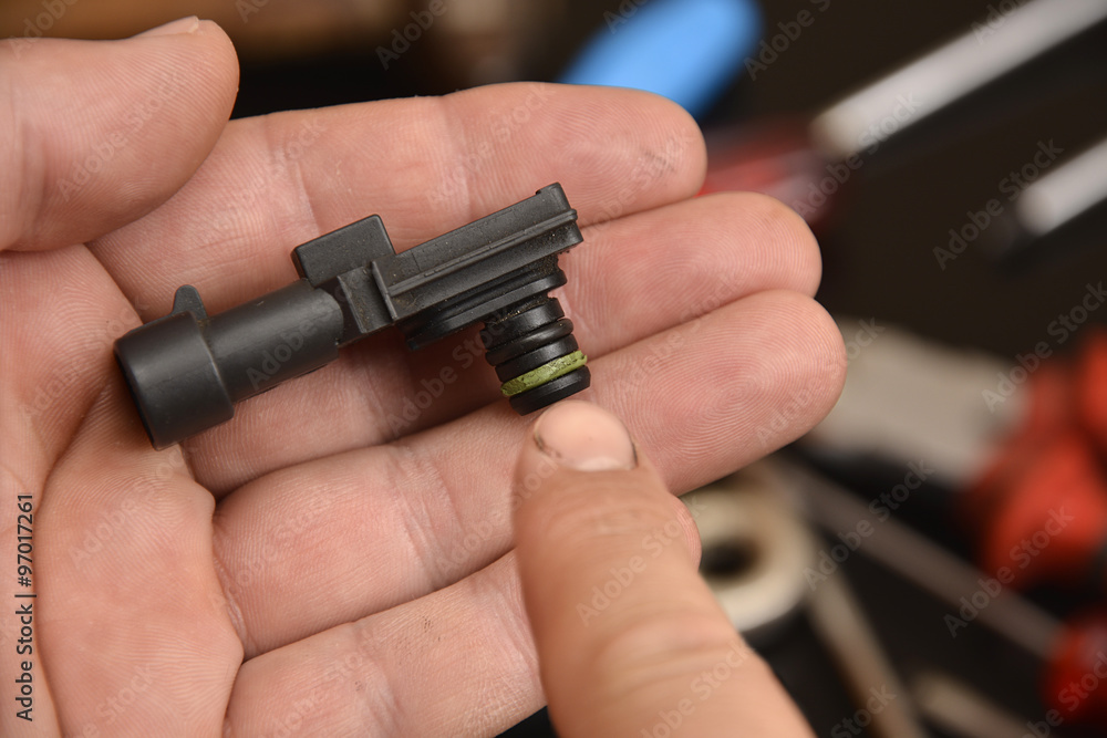 mechanic shows torn rubber gasket on the map sensor mechanic shows torn rubber gasket on the map sensor