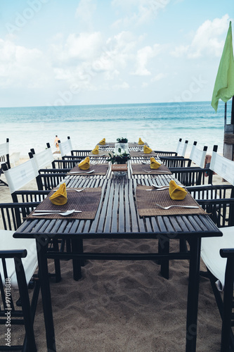 Served table at the sea shore on tropical beach