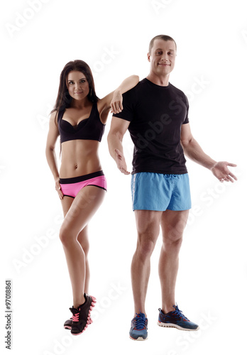 Sport. Attractive man and woman posing in studio © Wisky