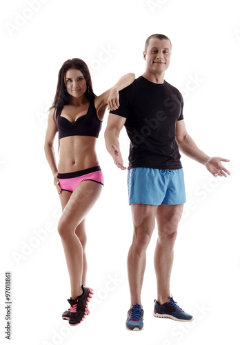 Sport. Attractive man and woman posing in studio