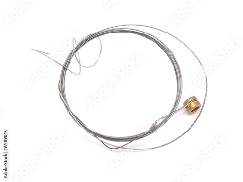 old guitar string on a white background