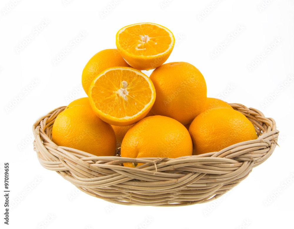 orange fruit in wicker baskets on white background orange fruit in wicker baskets on white background