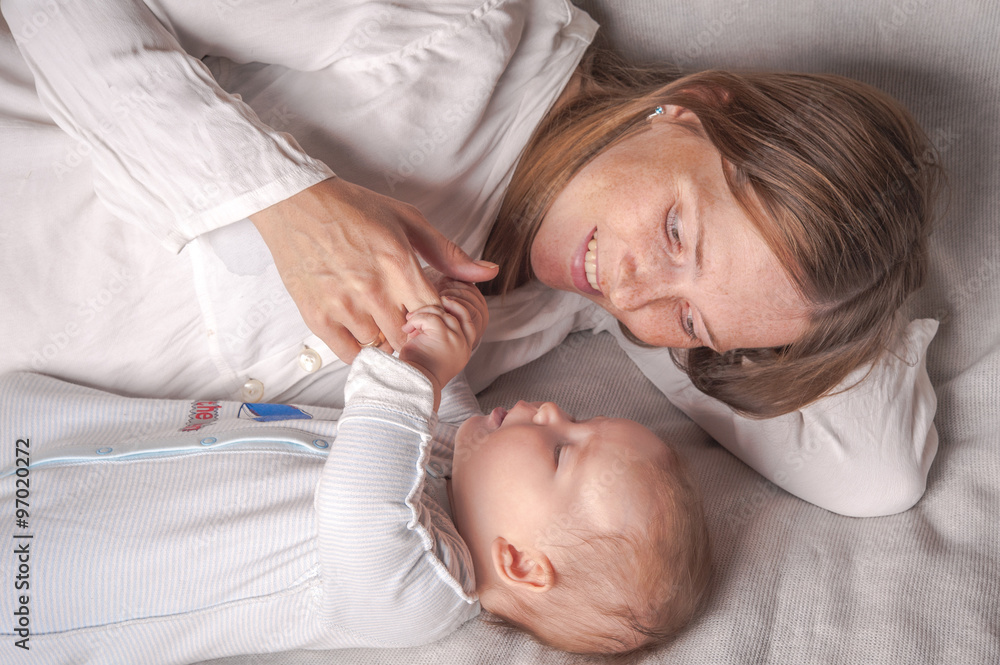 mother and baby in the bed. sleeping together mother and baby in the bed. sleeping together