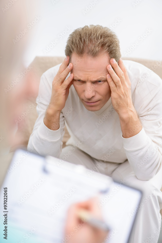 Senior man speaking with psychologist Senior man speaking with psychologist