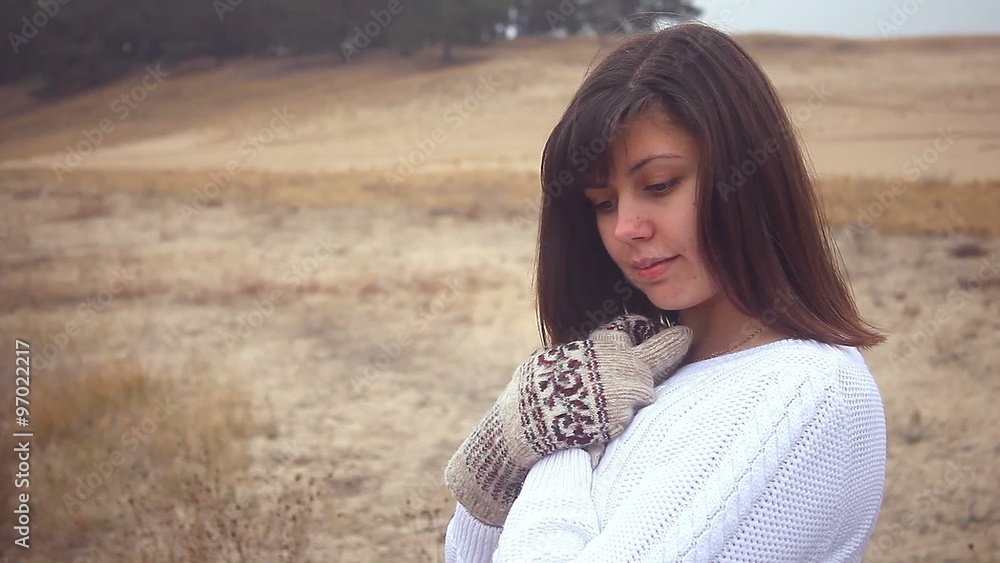 girl woman portrait in sweater and mittens on the nature autumn cold dry wood tree girl woman portrait in sweater and mittens on the nature autumn cold dry wood tree