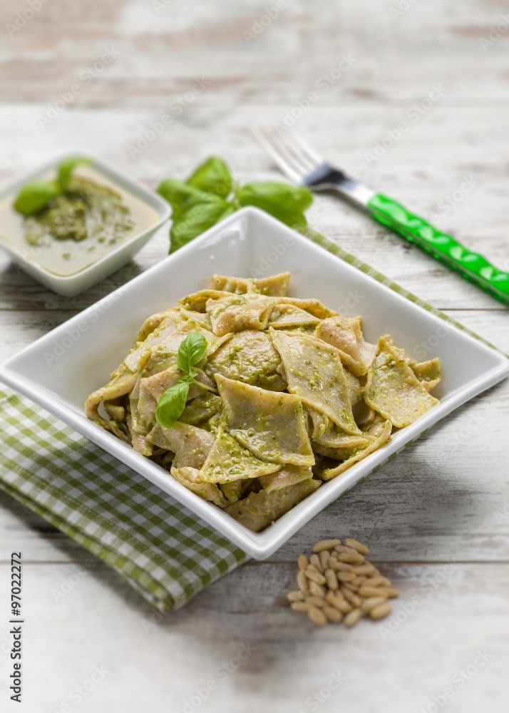 testaroli with pesto sauce, selective focus testaroli with pesto sauce, selective focus