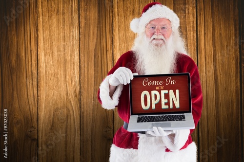 Wallpaper Mural Composite image of santa claus presents a laptop Torontodigital.ca