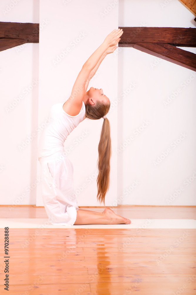 Woman practicing Yoga in a Studio.. Woman practicing Yoga in a Studio..