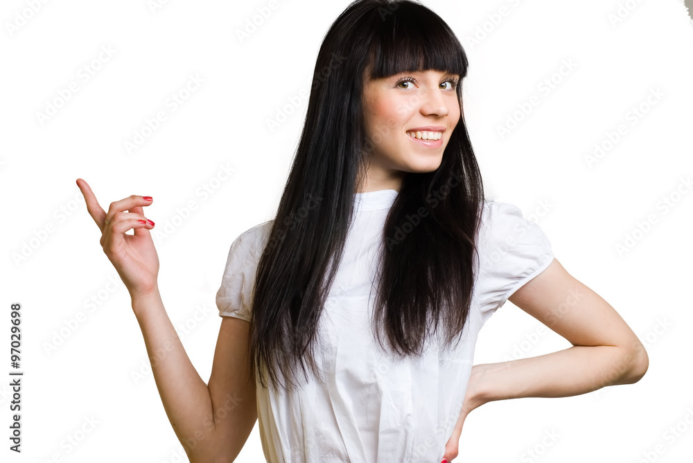 Pretty woman pointing finger towards blank space Pretty woman pointing finger towards blank space