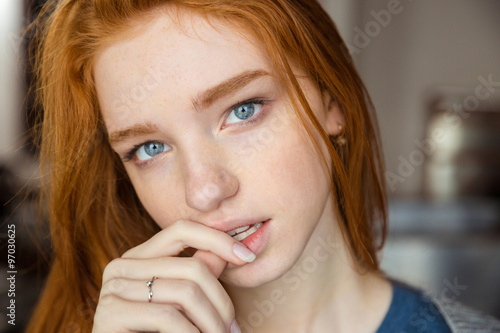 Redhead woman looking at camera