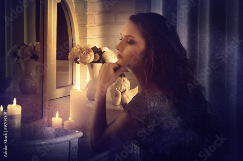 Retro style. Girl sits in front of a mirror