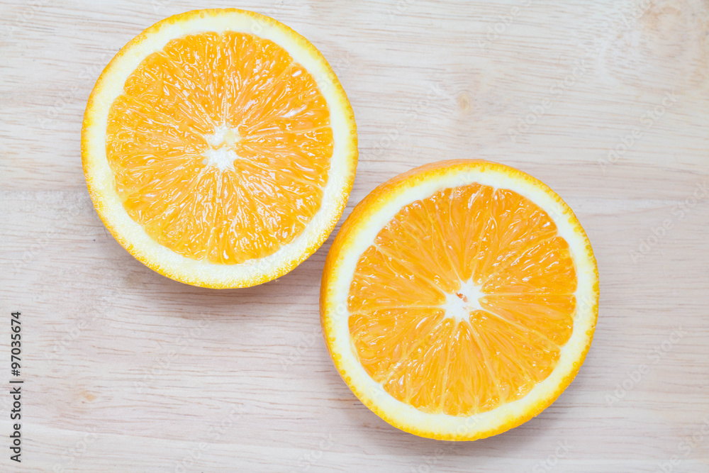 slice of orange fruit on wooden background slice of orange fruit on wooden background