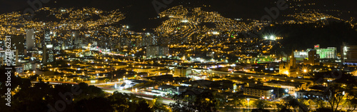 Aerial view of Medellin at night with residential and office buildings. Colombia
