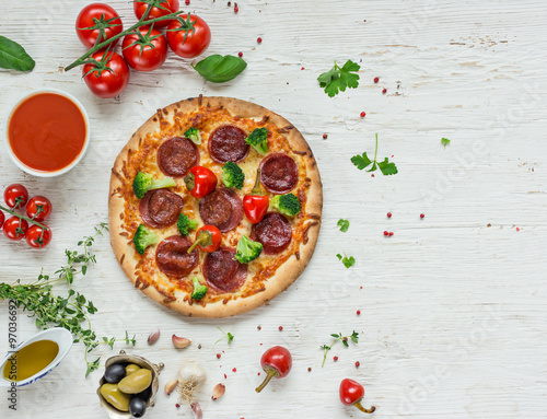 Fototapeta Naklejka Na Ścianę i Meble -  Delicious italian pizza served on wooden table