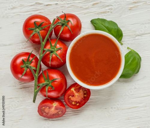 Bowl of tomato sauce with fresh ingredients