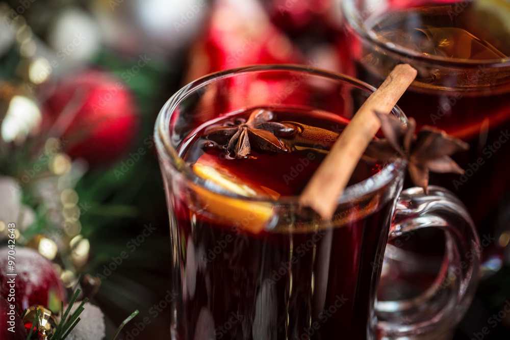 Christmas hot mulled wine with spices on a wooden table. The idea for creating greeting cards Christmas hot mulled wine with spices on a wooden table. The idea for creating greeting cards