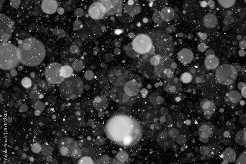 Falling Snow On The Black Background