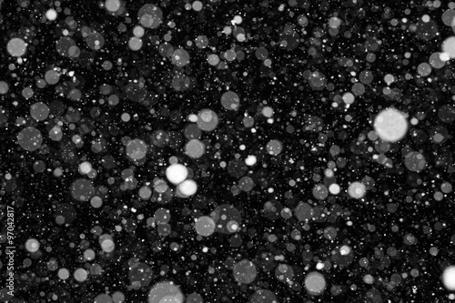 Falling Snow On The Black Background