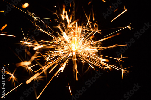 Wall Mural Christmas and New Year party sparkler on black