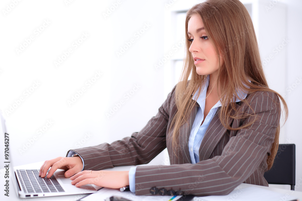 young business woman sitting at the desk on office background young business woman sitting at the desk on office background