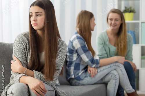 Hurt girl rejected by sisters photo