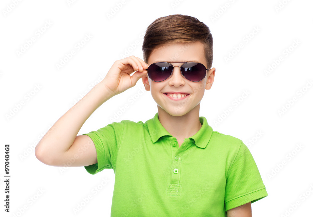 smiling boy in sunglasses and green polo t-shirt