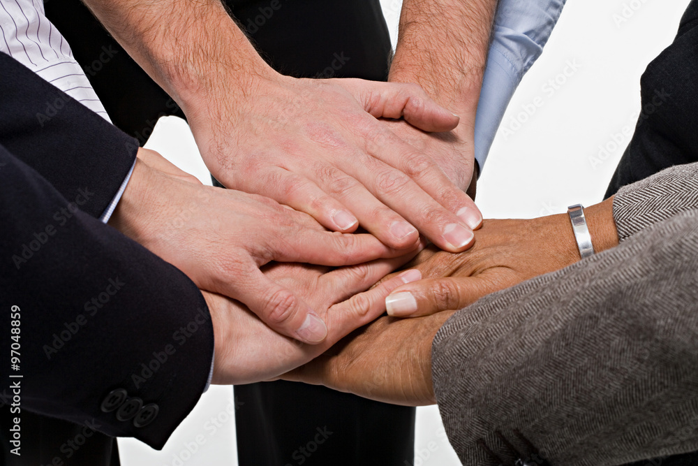 Close up of office workers showing unity Close up of office workers showing unity