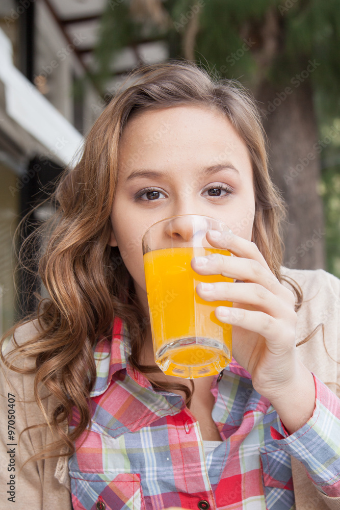 Girl in the street drink a juice Girl in the street drink a juice