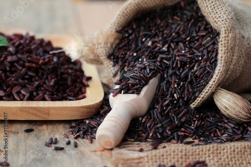 Raw purple rice berries and cooked of delicious for health.