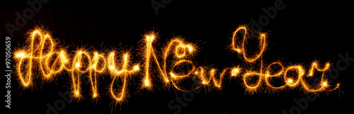 Happy New Year made of sparkles on black