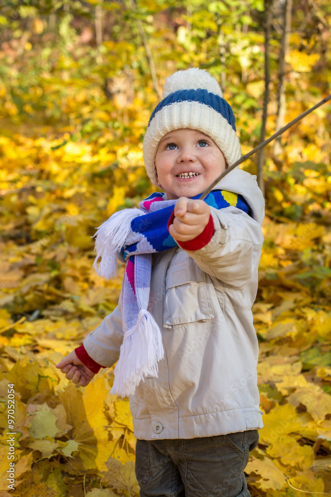 Little boy with beautiful eyes looking up in the autumn park Little boy with beautiful eyes looking up in the autumn park
