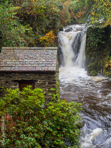 Autumn waterfall following heavy rainfall at Rydal mount, Rydal, Cumbria, UK photo