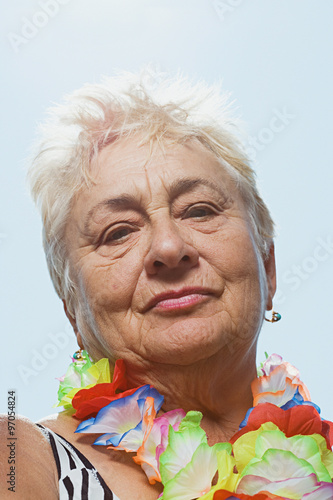 Senior woman wearing a flowing garland
