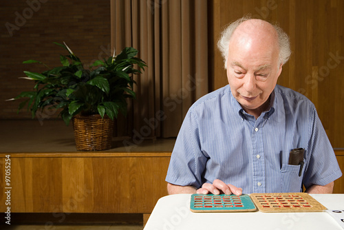 Senior man playing bingo