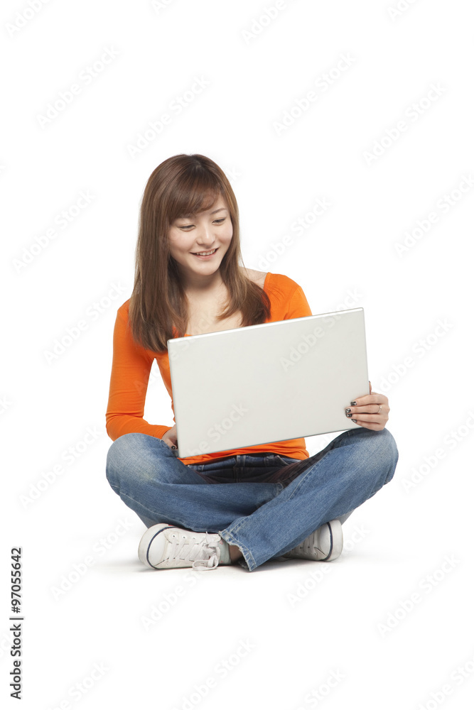Young woman using a laptop computer Young woman using a laptop computer
