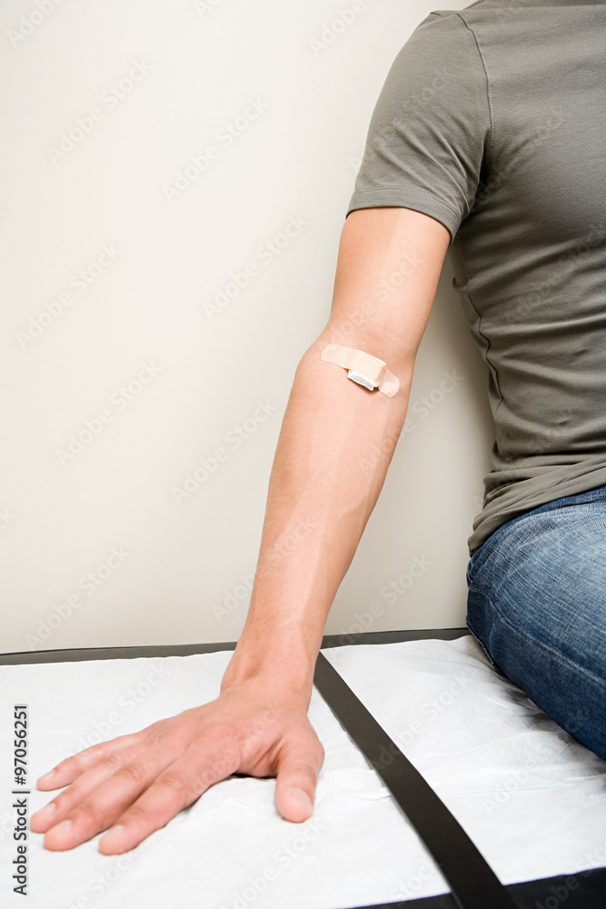 Man with plaster on arm