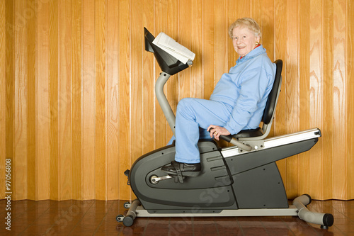 Senior woman on an exercise bike