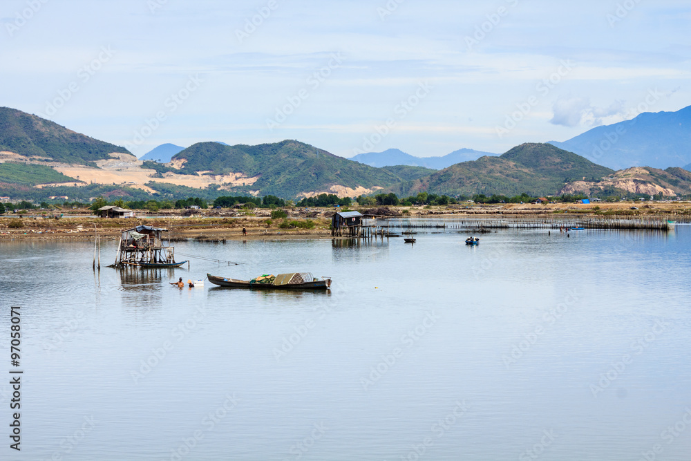 Fisherman at Tac river, Nha Trang, Khanh Hoa, Vietnam. Nha Trang is well known for its beaches and scuba diving and has developed into a destination for international tourists.